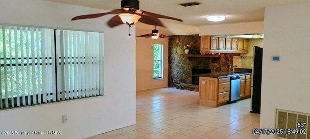 12437 Drayton Dr, Spring Hill, FL 34609 - kitchen featuring ceiling fan, dark countertops, dishwashing machine, and visible vents