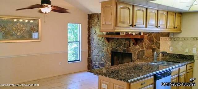 12437 Drayton Dr, Spring Hill, FL 34609 - kitchen with dark stone counters, vaulted ceiling, a sink, ceiling fan, and dishwashing machine
