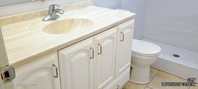 12437 Drayton Dr, Spring Hill, FL 34609 - bathroom featuring walk in shower, toilet, vanity, and tile patterned floors