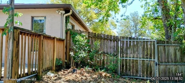 12437 Drayton Dr, Spring Hill, FL 34609 - exterior space with stucco siding and a fenced backyard