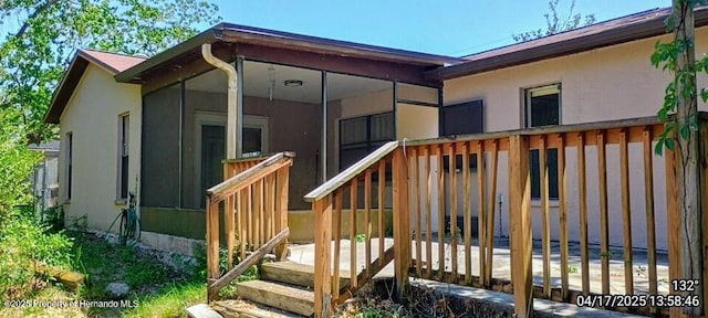 12437 Drayton Dr, Spring Hill, FL 34609 - wooden terrace with a sunroom