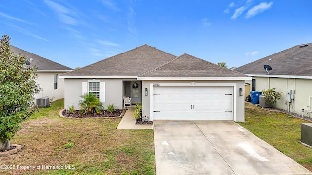 ranch-style home with a shingled roof, a front lawn, stucco siding, a garage, and driveway