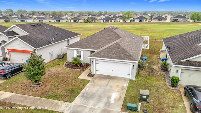 birds eye view of property with a residential view