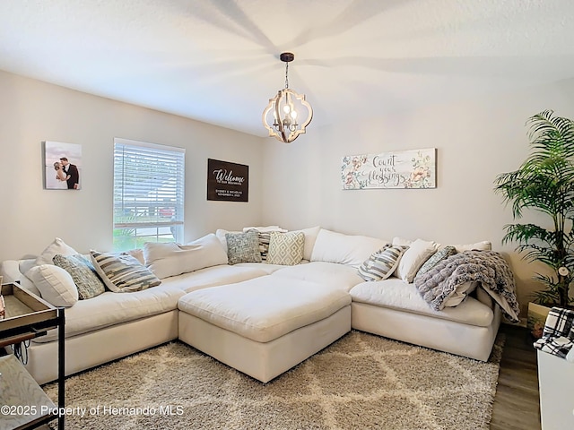 living room featuring light wood finished floors and a notable chandelier