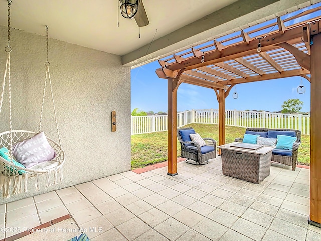 view of patio / terrace with an outdoor living space, a fenced backyard, a ceiling fan, and a pergola