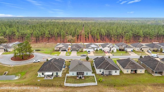 bird's eye view with a residential view and a wooded view