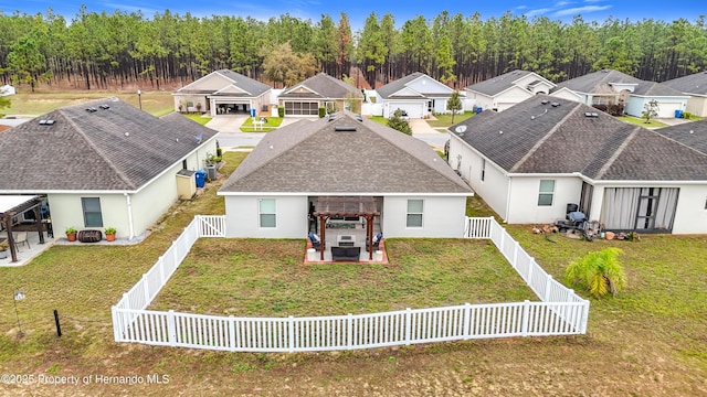 birds eye view of property with a residential view