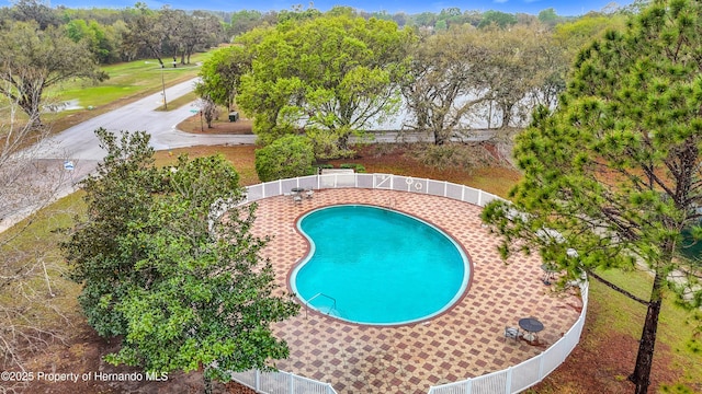 view of swimming pool featuring a fenced in pool and fence