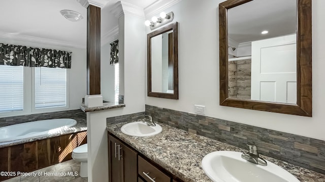 full bath with a sink, a garden tub, crown molding, and toilet