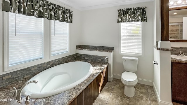 bathroom featuring crown molding, toilet, a garden tub, tile patterned floors, and vanity