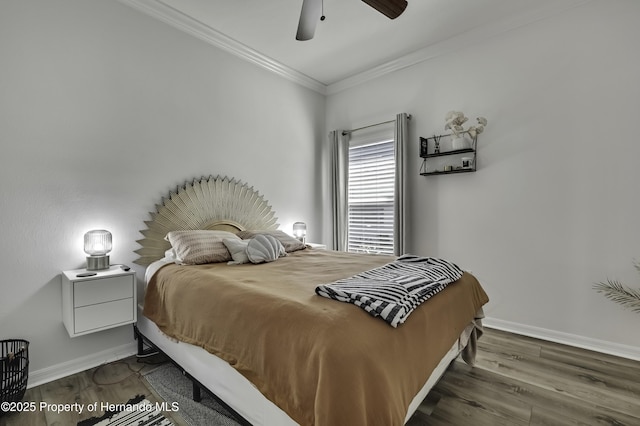 bedroom with a ceiling fan, wood finished floors, baseboards, and ornamental molding