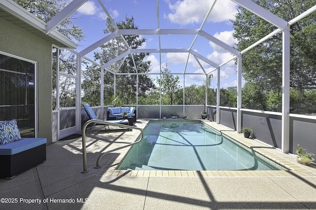 view of pool with an outdoor living space, a patio, and a fenced in pool