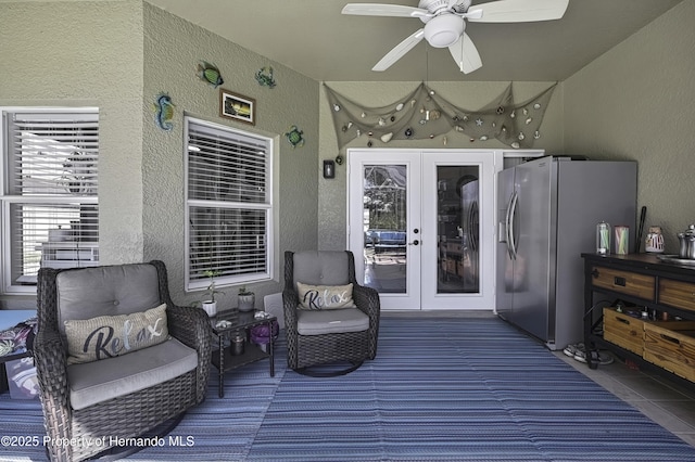 wooden deck with french doors and ceiling fan