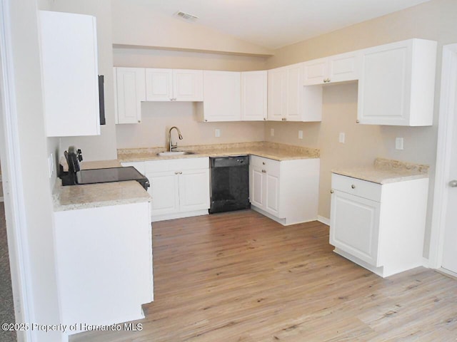 kitchen with visible vents, electric range, a sink, vaulted ceiling, and black dishwasher