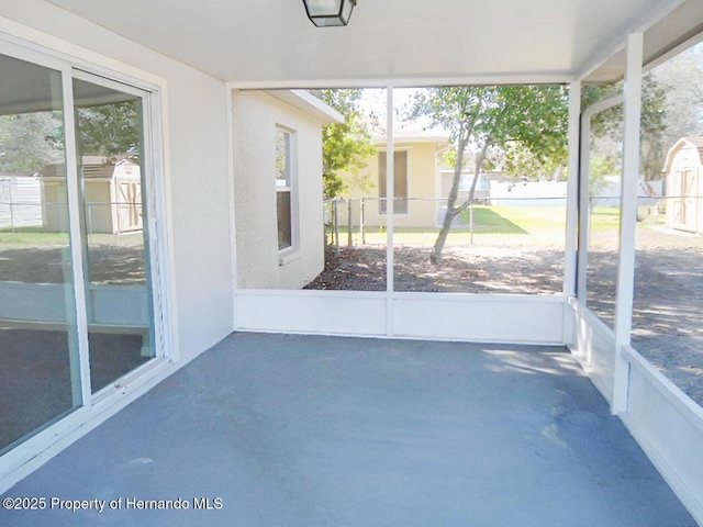 unfurnished sunroom with a wealth of natural light