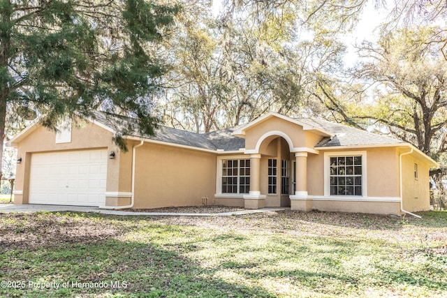 single story home featuring roof with shingles, stucco siding, concrete driveway, a front lawn, and a garage