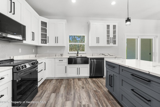 kitchen featuring gray cabinetry, black range with electric stovetop, stainless steel dishwasher, white cabinets, and a sink