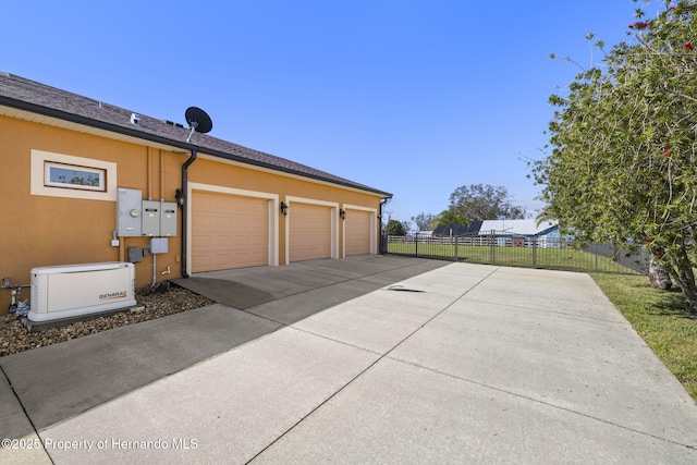 garage with fence