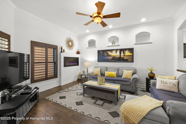 living room featuring recessed lighting, baseboards, wood finished floors, and ornamental molding
