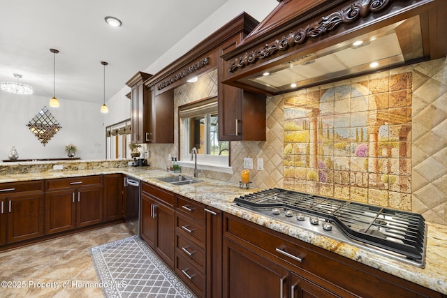kitchen with light stone counters, stainless steel appliances, a sink, custom range hood, and backsplash