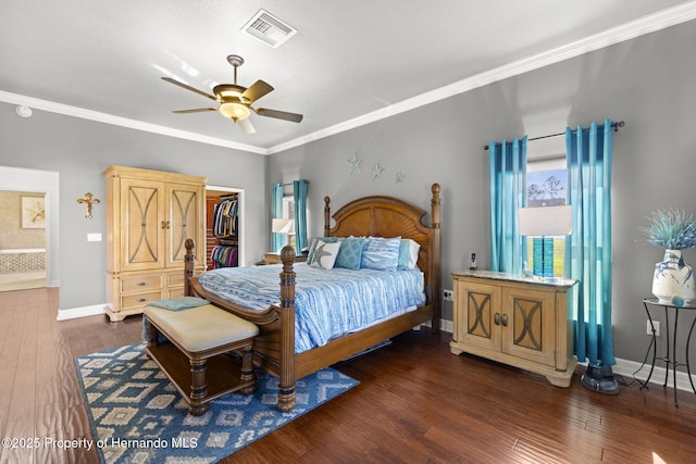 bedroom featuring visible vents, baseboards, dark wood-style floors, and crown molding