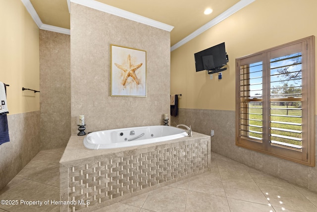 full bath with tile patterned flooring, a whirlpool tub, tile walls, and ornamental molding