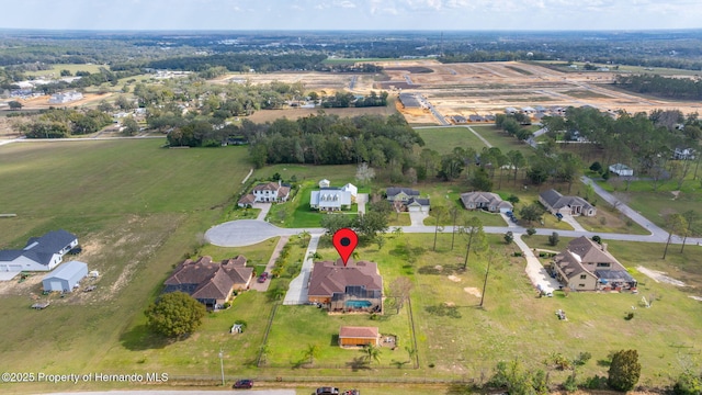 birds eye view of property featuring a rural view
