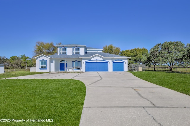 view of front of house featuring a front lawn, a porch, an attached garage, and fence