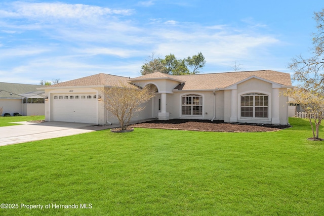 view of front of home with fence, an attached garage, stucco siding, a front lawn, and concrete driveway