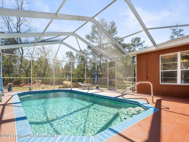 outdoor pool with a patio area and a lanai