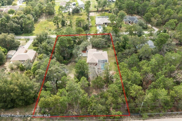 aerial view featuring a view of trees