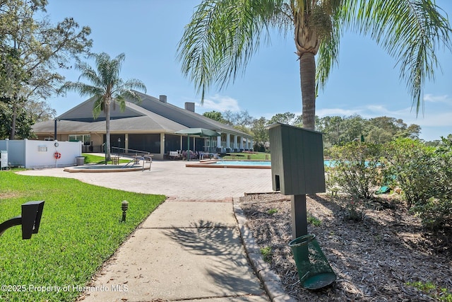 exterior space featuring a yard and fence