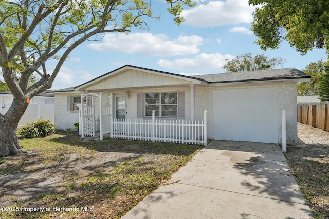 ranch-style house with covered porch, fence private yard, and stucco siding