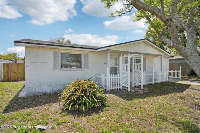 view of front of home with fence