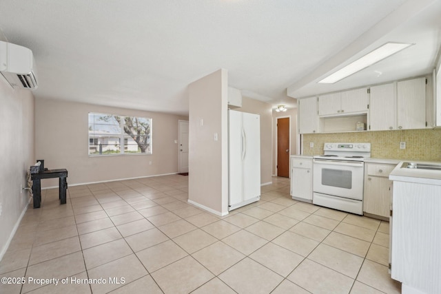 kitchen featuring backsplash, white appliances, light countertops, and a wall unit AC