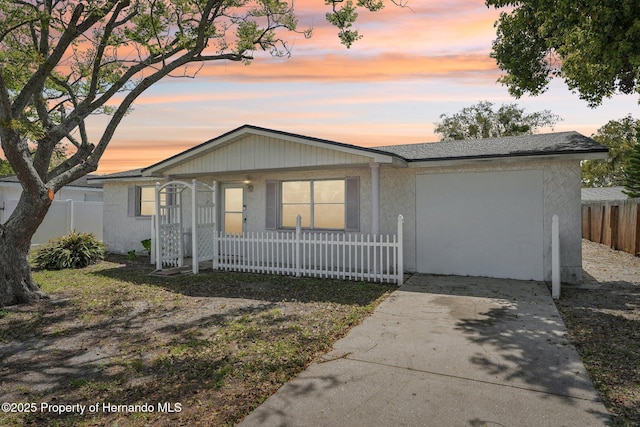 view of front of home featuring a fenced front yard and covered porch