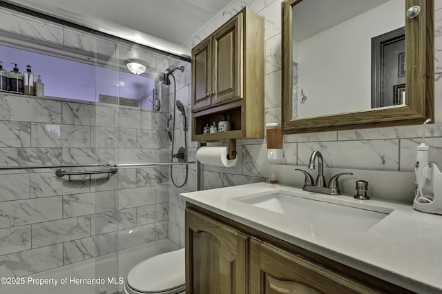 bathroom featuring decorative backsplash, toilet, vanity, and shower / bathing tub combination