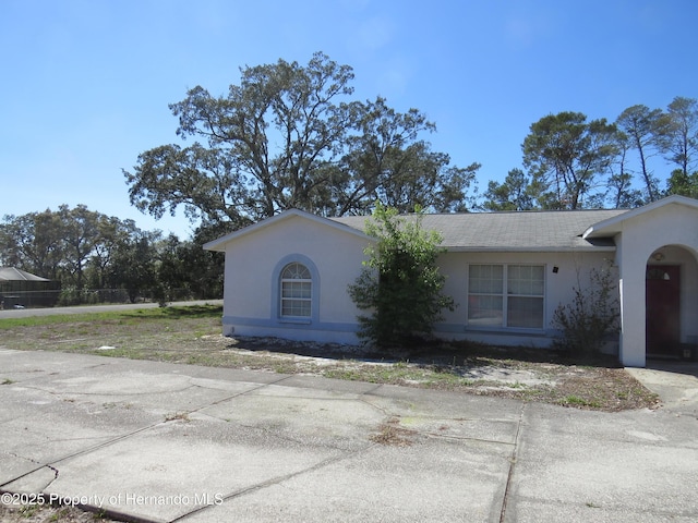 view of front of house featuring stucco siding