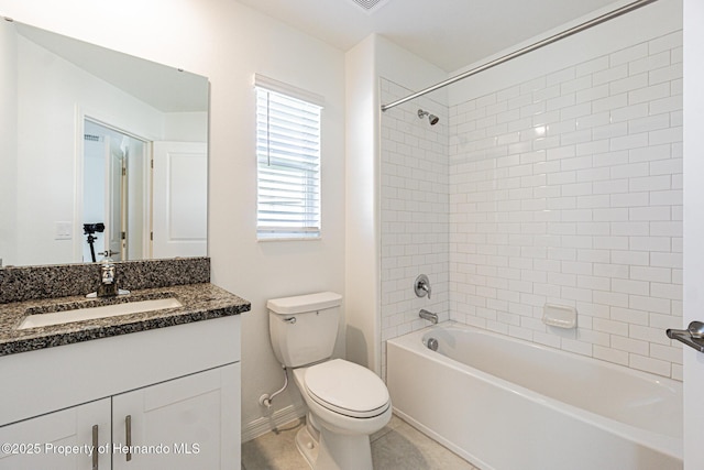 bathroom featuring baseboards, toilet, bathing tub / shower combination, tile patterned floors, and vanity