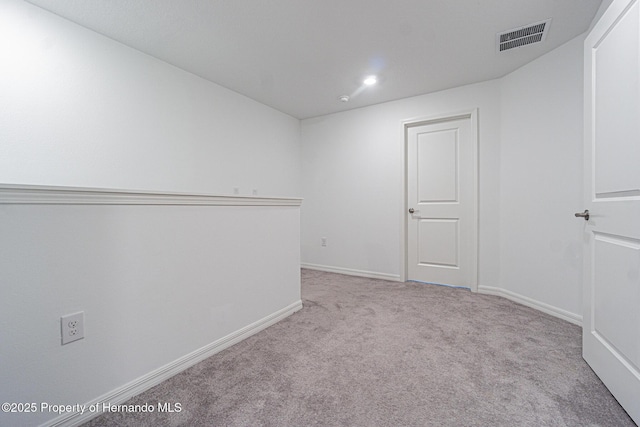 spare room with recessed lighting, visible vents, baseboards, and carpet flooring