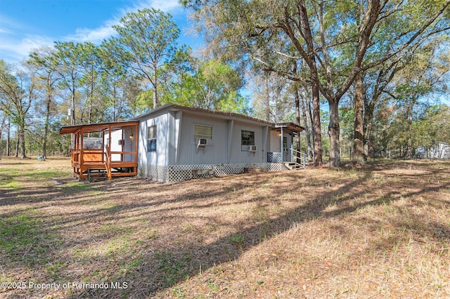 view of property exterior with a lawn