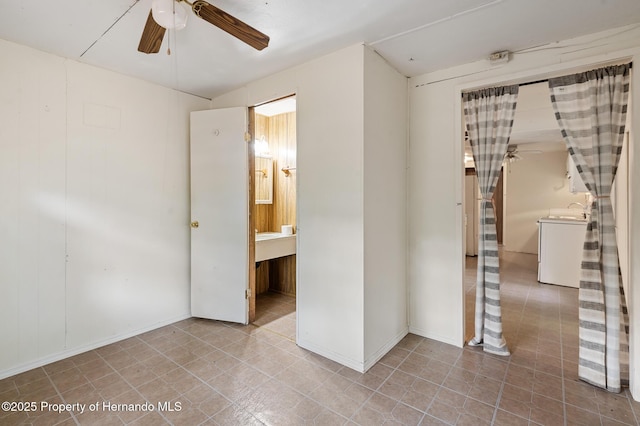 spare room with a sink and ceiling fan