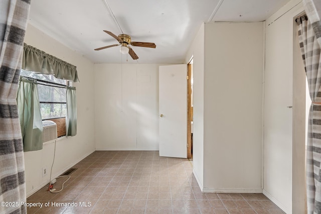 spare room featuring visible vents, ceiling fan, and tile patterned flooring