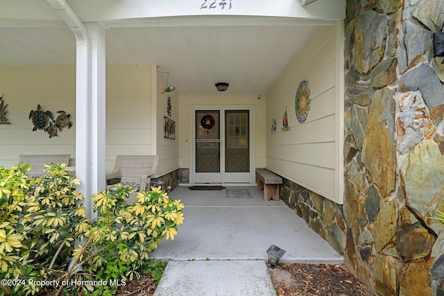 doorway to property featuring a porch