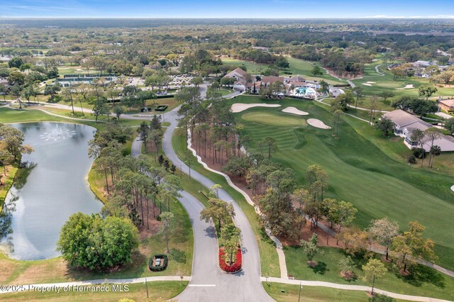 drone / aerial view featuring a water view and view of golf course