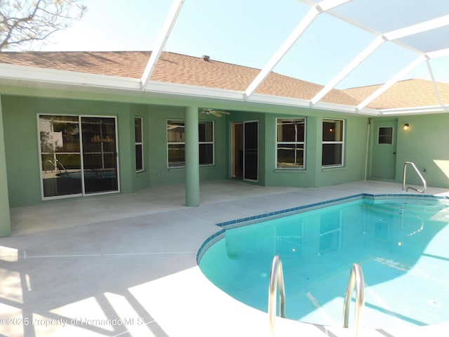 pool with ceiling fan, a patio, and a lanai