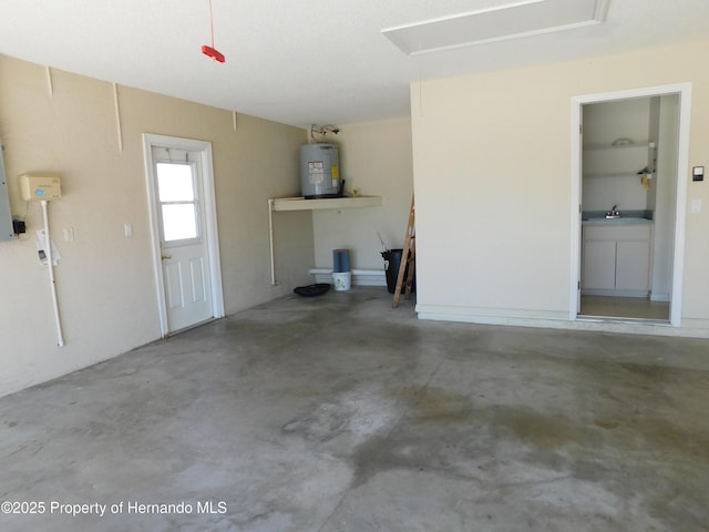 garage with a sink and electric water heater