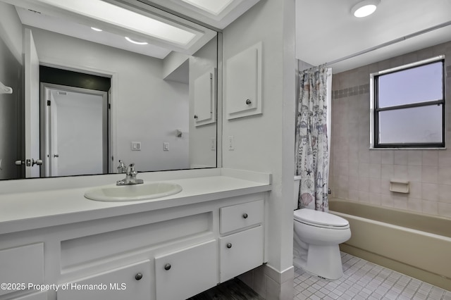 full bath with shower / bath combo, toilet, vanity, and tile patterned floors