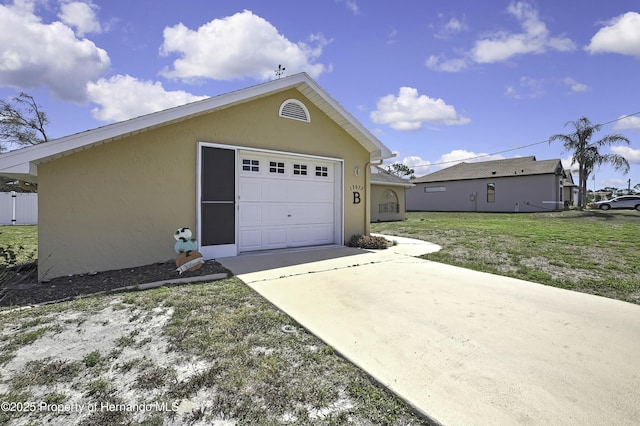 garage with concrete driveway