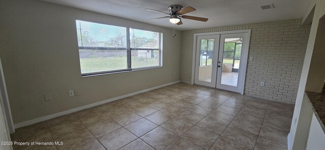 16402 Killearn Ln, Spring Hill Pasco, FL 34610 - spare room with french doors, ceiling fan, light tile patterned flooring, and baseboards